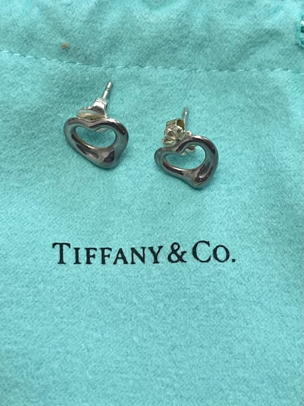 Tiffany & Co. Sterling Silver Open Heart Stud Earrings on Blue Pouch